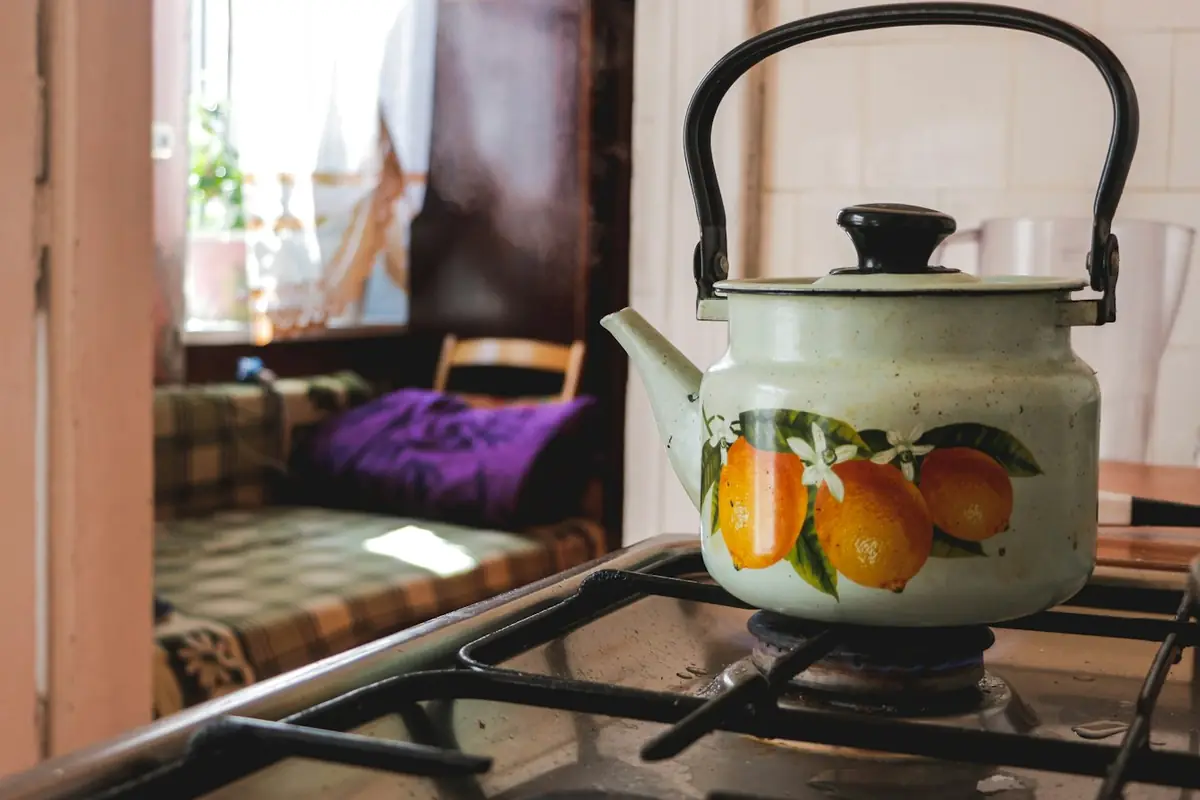 A kettle on a gas stove