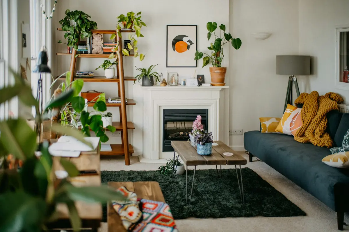 A living room with a fireplace and sofa