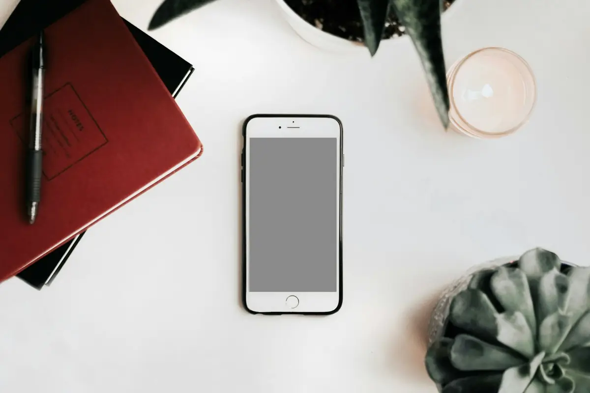 A smartphone on a white desk