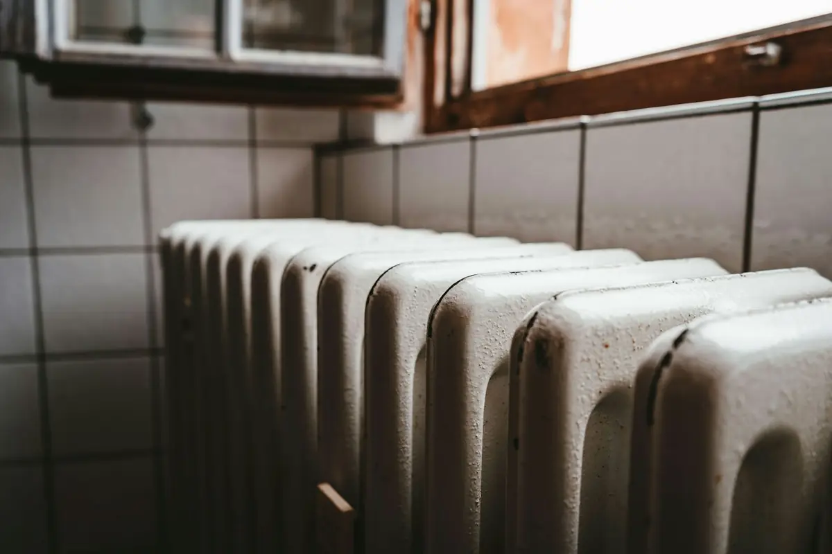 A white radiator under a window