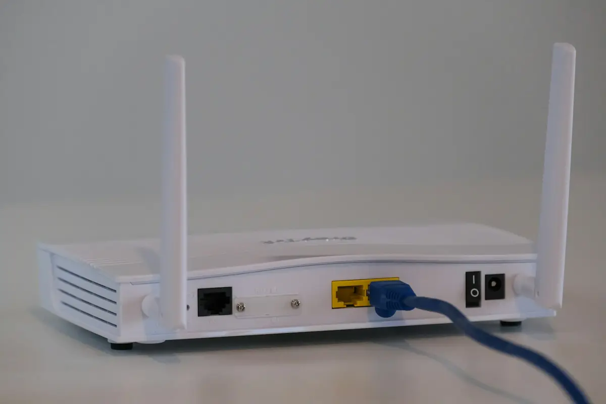 A white broadband router on a table