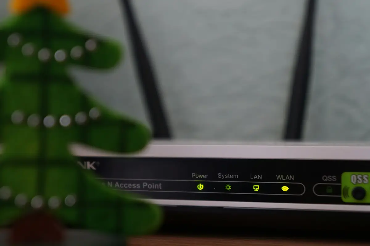 A broadband router with its status lights on