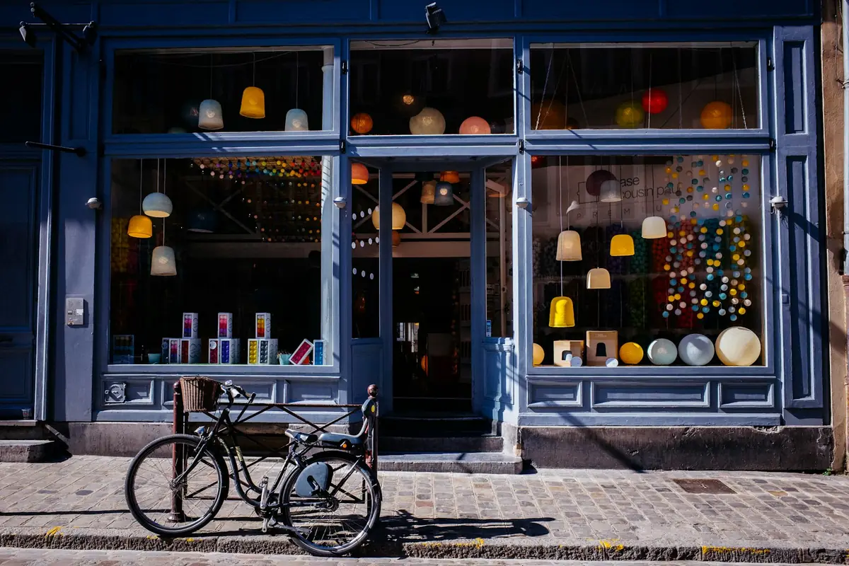 A small shop front with a bicycle outside